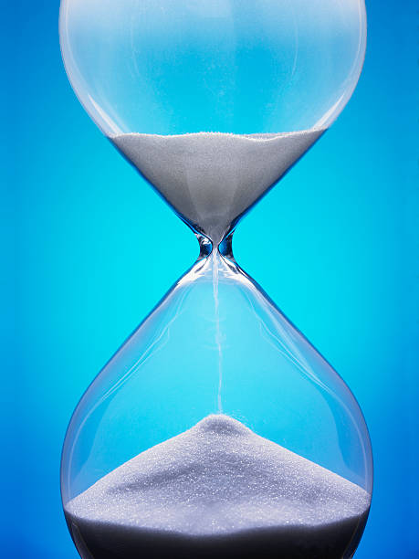 istock Large hourglass with white sand against a blue background 93930753