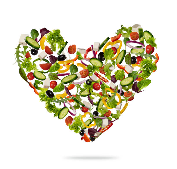 istock Heart shape made of various kind of vegetable on white 939310502