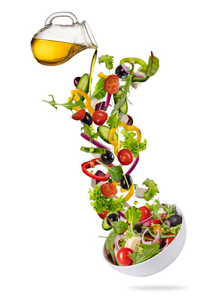 istock Flying vegetable greek salad isolated on white background. 939310714