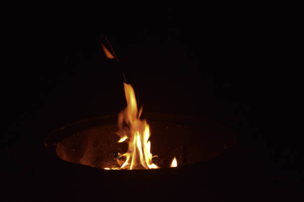 istock Ball of flames on black backdrop 939313306