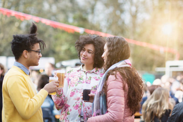istock Festival : friends having a drink together 939313602