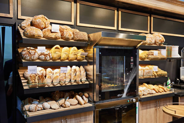 istock Fresh bread and pastries on shelves in bakery 939313824