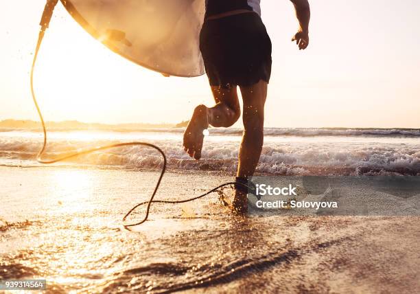 Man Surfer Run In Ocean With Surfboard Active Vacation Health Lifestyle And Sport Concept Image Stock Photo - Download Image Now