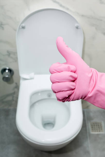 Hand with glove showing thumb up