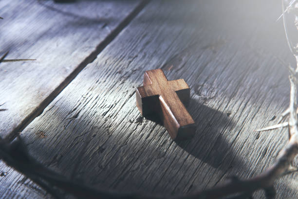 istock wooden cross and thorn 939321902