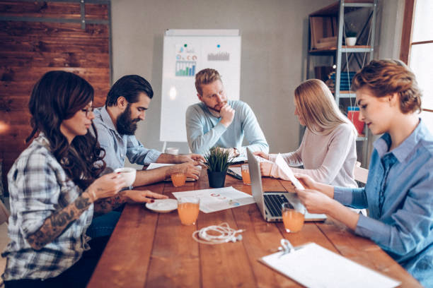 istock Co-workers discussing about new business ideas 939329040