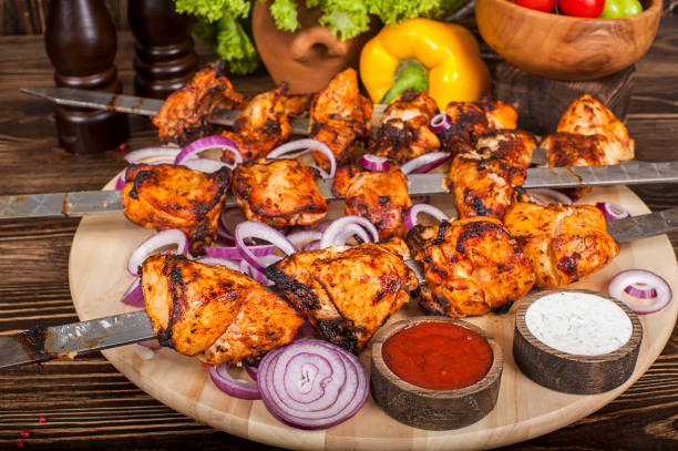 istock Raw barbecue shish kebabs - grilled meat 939329938