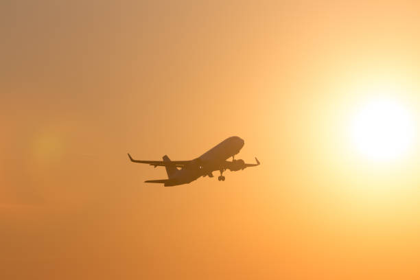 istock passenger airplane starting in the evening sun 939329986