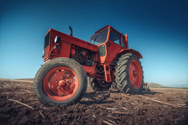 istock Farmer in tractor preparing land with seedbed cultivator 939330174