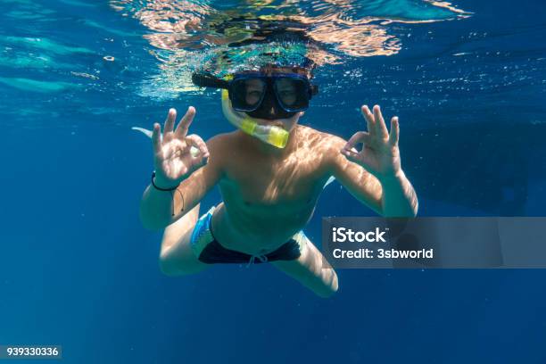 Boy In Swimming Mask Dive In Red Sea Near Yacht Stock Photo - Download Image Now - Scuba Mask, Swimming, Boys