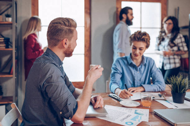 istock Co-workers discussing about new business ideas 939338560