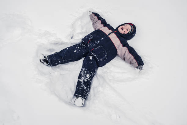istock boy lies on north pole snow 939341324