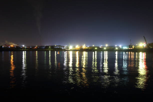 istock Factory night view and the sea 939341700