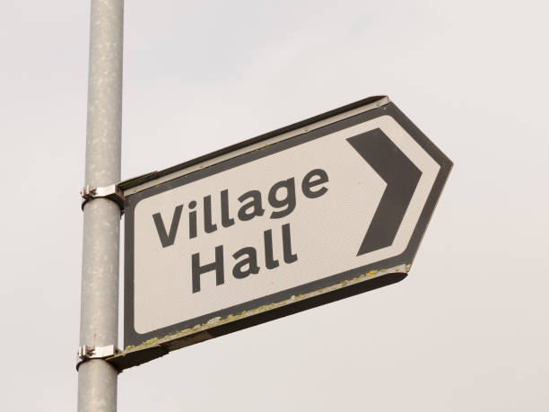 istock white and black village hall sign post direction street 939342240