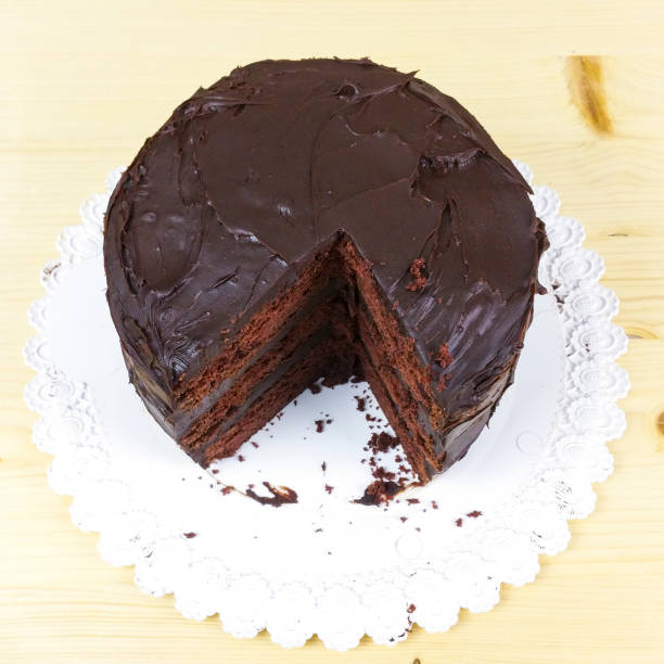 istock Homemade Devil's cake on wooden background - top view 939342694