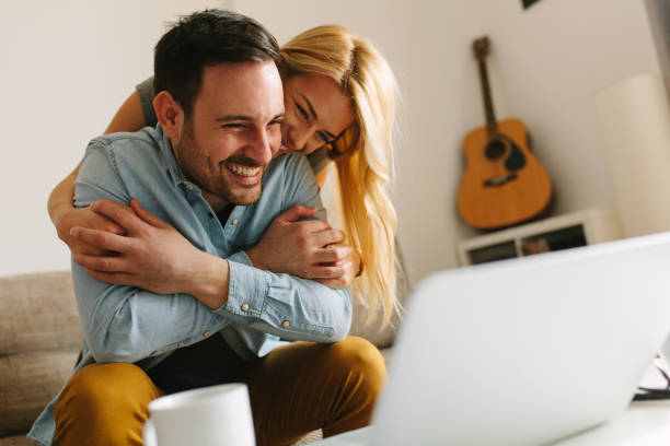 istock Happy couple relaxed at home 939348380