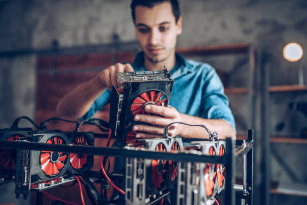 Setup GPU mining rig Programmer preparing mining rig with GPU graphics card stock pictures, royalty-free photos & images