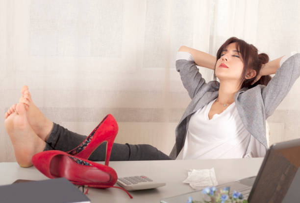 istock woman rubbing eyes at office 939351980