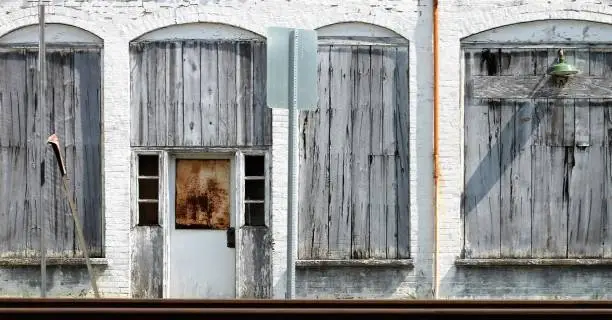 Old Building, Old Post Office, Brick, White building, Wood over the Windows, Rusty Door