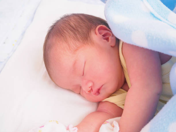 istock Newborn baby girl sleeping 939355696