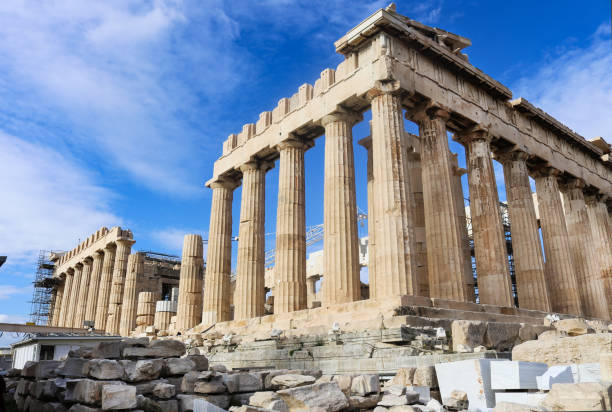 istock Closeup of Parthenon on Acropolis angled against very blue sky showing ongoing reconstruction work on far side - Athens Greece 1-3-2018 939371382
