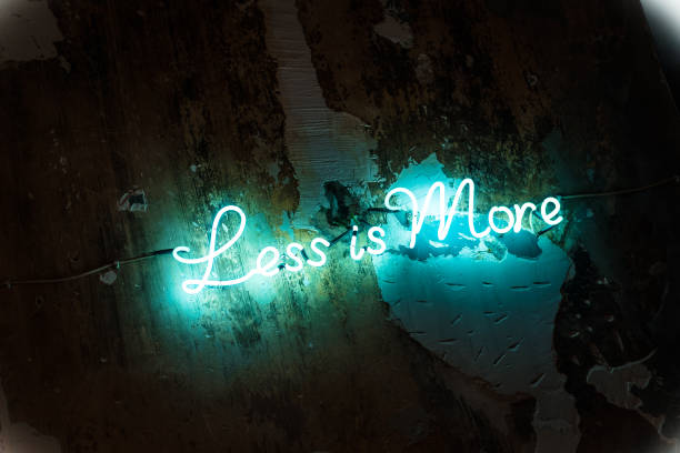 Neon sign with short motivational quote against brick wall.