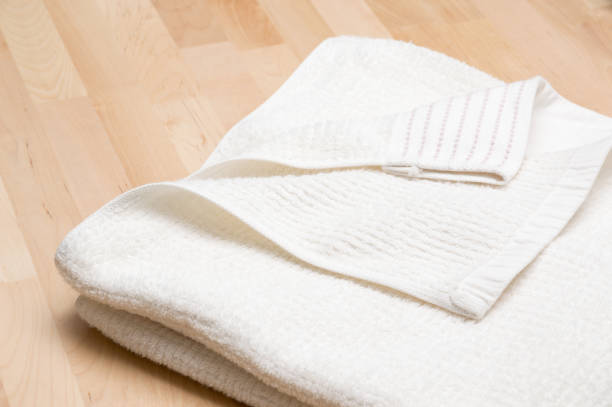 istock Towel and wooden table 939377156