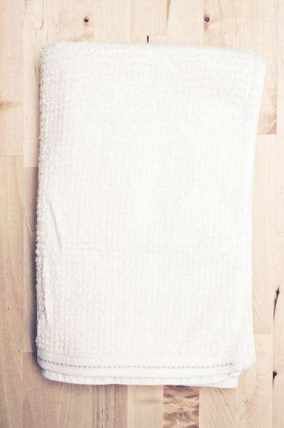 istock Towel and wooden table 939377164