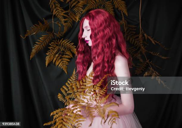Beautiful Preraphaelite Girl With Curly Red Hair With A Flying Tulle Dress On Black Background Stock Photo - Download Image Now