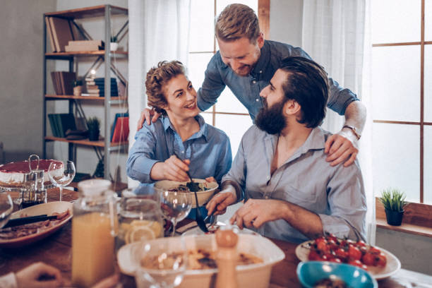 istock Friends eating together 939388382