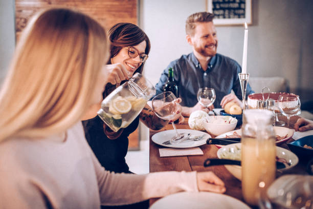 istock Friends eating together 939388642