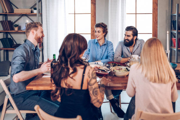 istock Friends eating together 939395020
