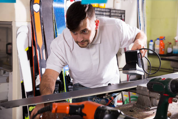 istock Workman repair of skis in workshop 939399154