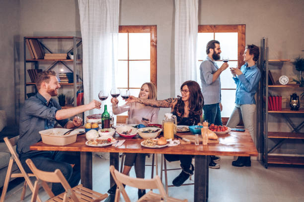istock Friends eating together 939401544