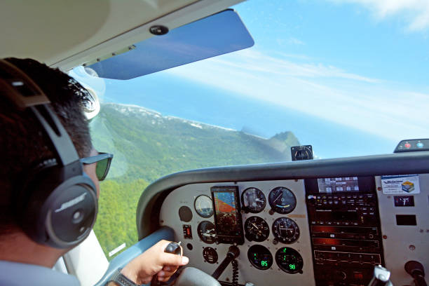 Air Rarotonga pilot fly Cessna 172 Skyhawk on a scenic flight above Rarotonga Island the largest of the Cook Islands, a nation of 15 islands in the central South Pacific.