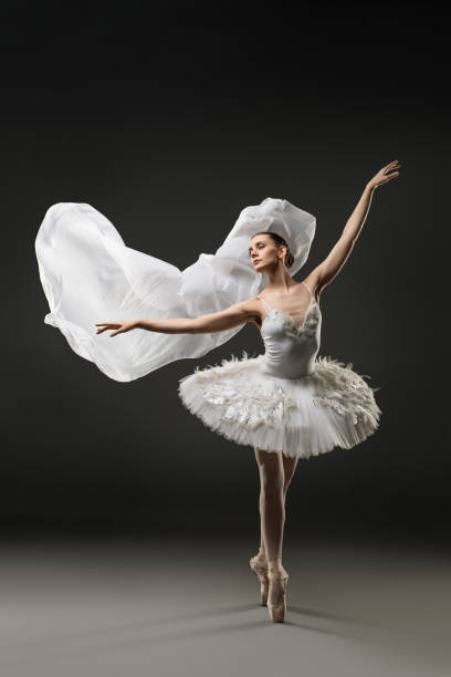 istock Beautiful ballerina dancing on pionte view 939412374