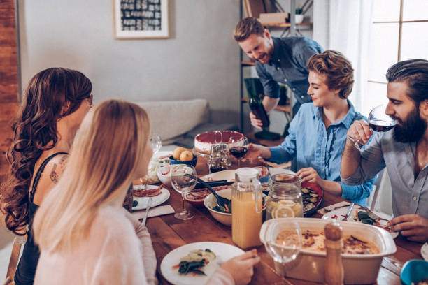 istock Friends eating together 939420434