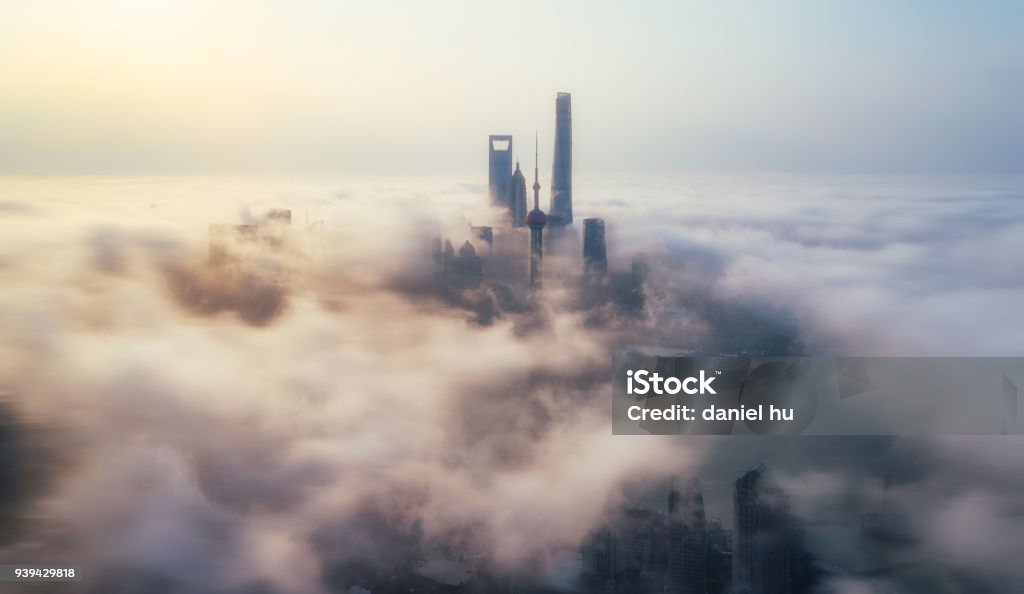 skyscrapers above the cloud in Shanghai skyscrapers in Lujiazui district above the advection fog at sunrise ,Shanghai Cloud - Sky Stock Photo