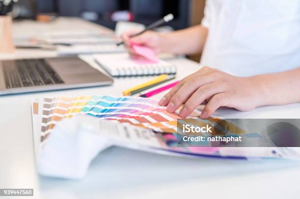 Close Up View Of Male Designer Pointing On Color Shade Swatch And Choosing Color For New Project Stock Photo - Download Image Now