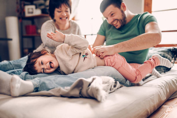 istock Parents with only daughter playing in the morning 939450802