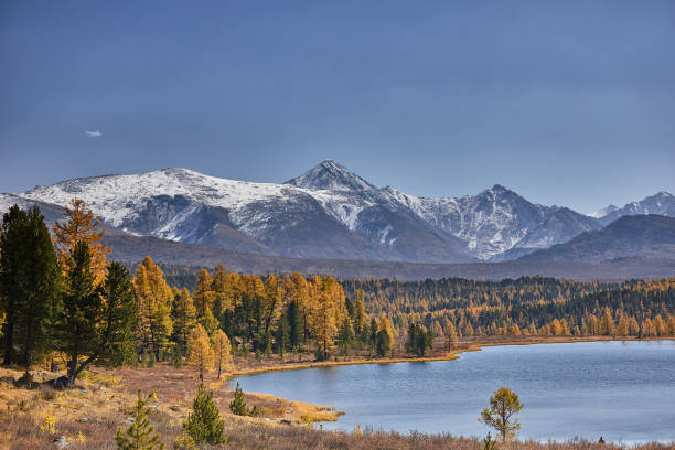 istock First snow on Lake. Colorful autumn landscape 939453734