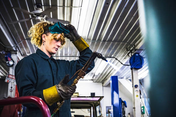istock Female mechanic lit blows the torch 939454592