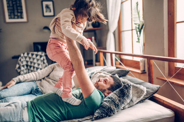 istock Parents with only daughter playing in the morning 939460514