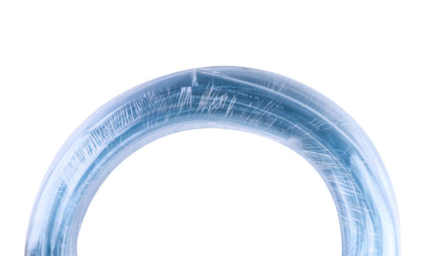 curled garden hose in plastic wrap isolated on white background,with clipping path - hose clip imagens e fotografias de stock