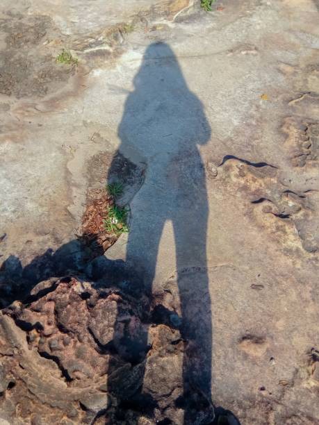 istock Shadow woman on stone floor. 939472248