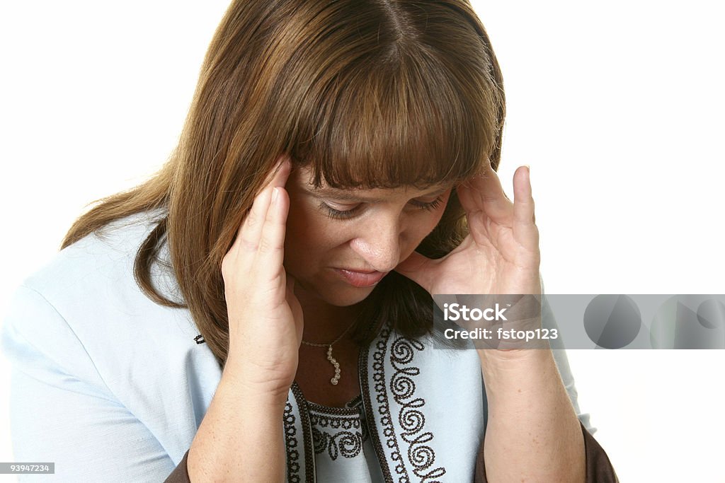 Stressed woman with head in hands. Woman with stress headache and problems. Head in hands, white background. 30-39 Years Stock Photo