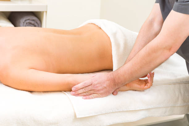 istock Massage on a woman at spa salon 939476828