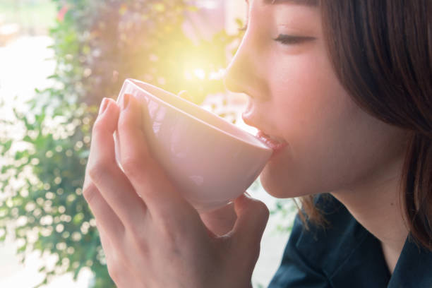 istock woman smell coffee 939477348