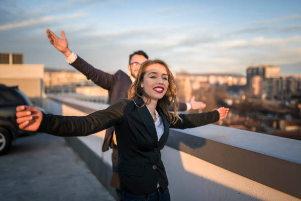 istock Young female entrepreneur enjoying sunset with partner 939481710