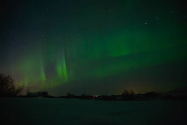 istock houses under sky with spectacular aurora borealis in iceland 939485572